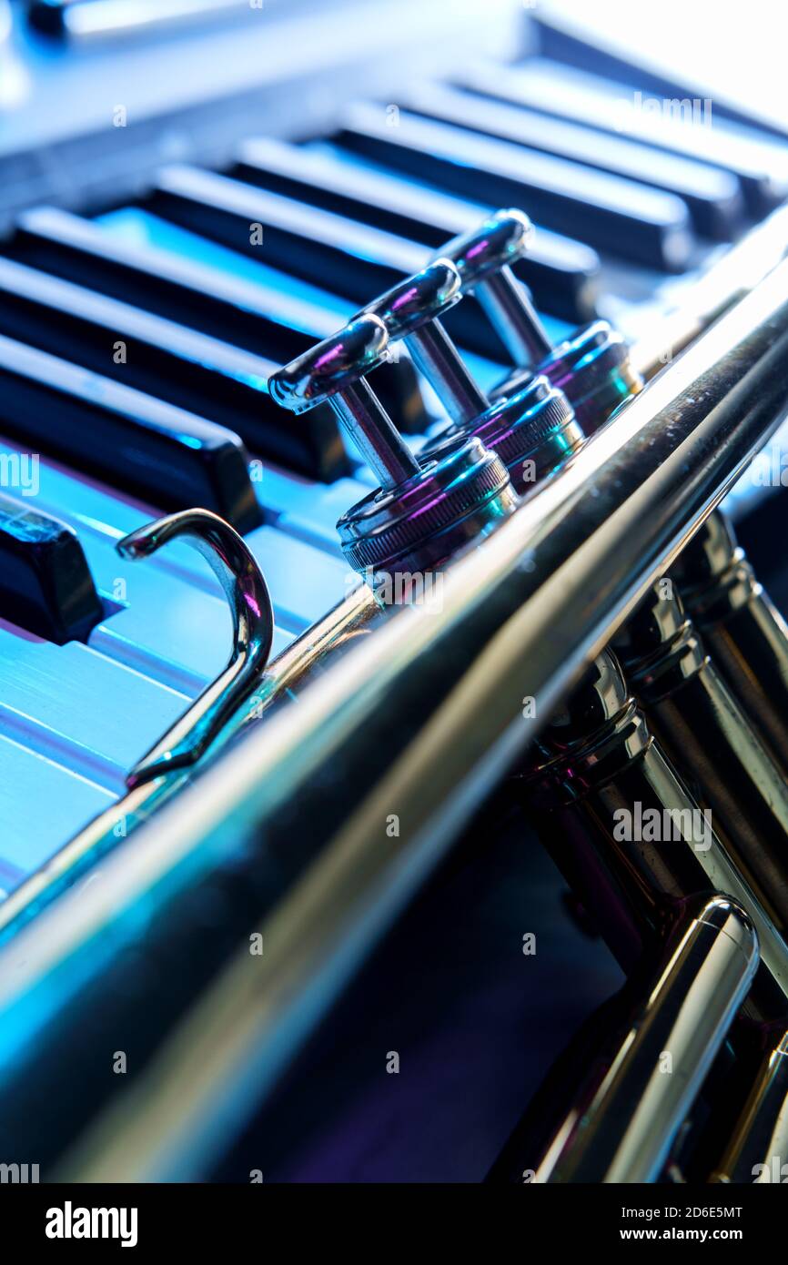 Old and worn Jazz trumpet and piano keyboard musical show and