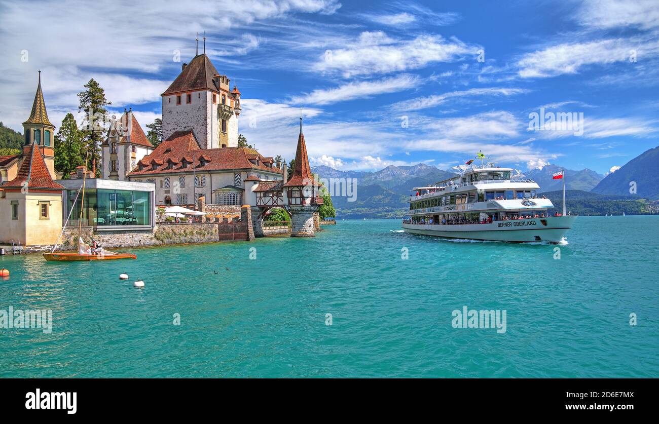 Oberhofen Castle on the lakeshore with excursion boat, Oberhofen, Lake Thun, Bernese Oberland, Canton of Bern, Switzerland Stock Photo