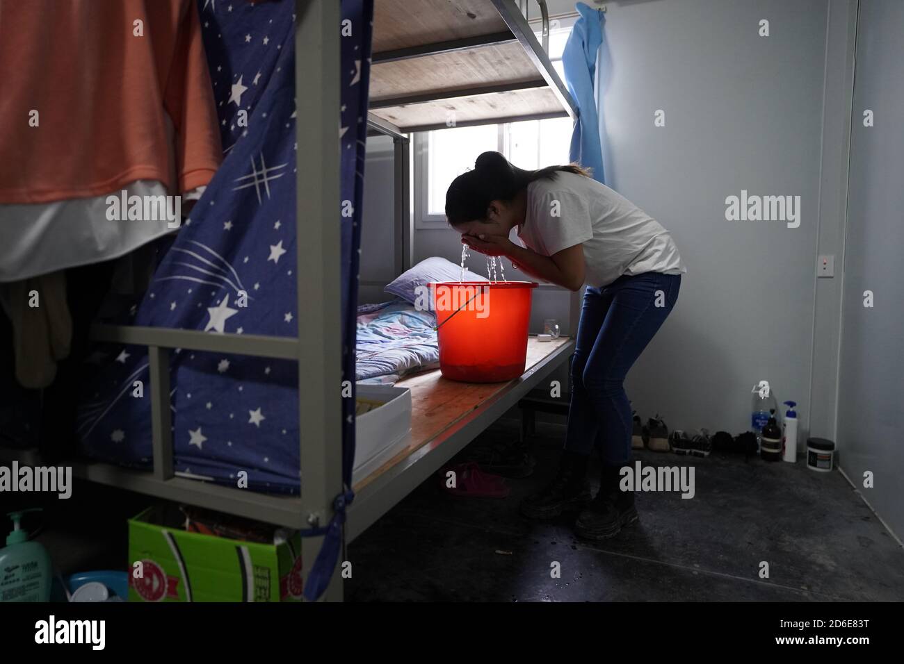 Driver Dormitory Xiongan. 25th Sep, 2020. Tower crane driver Aluo Chunmei washes face in ...