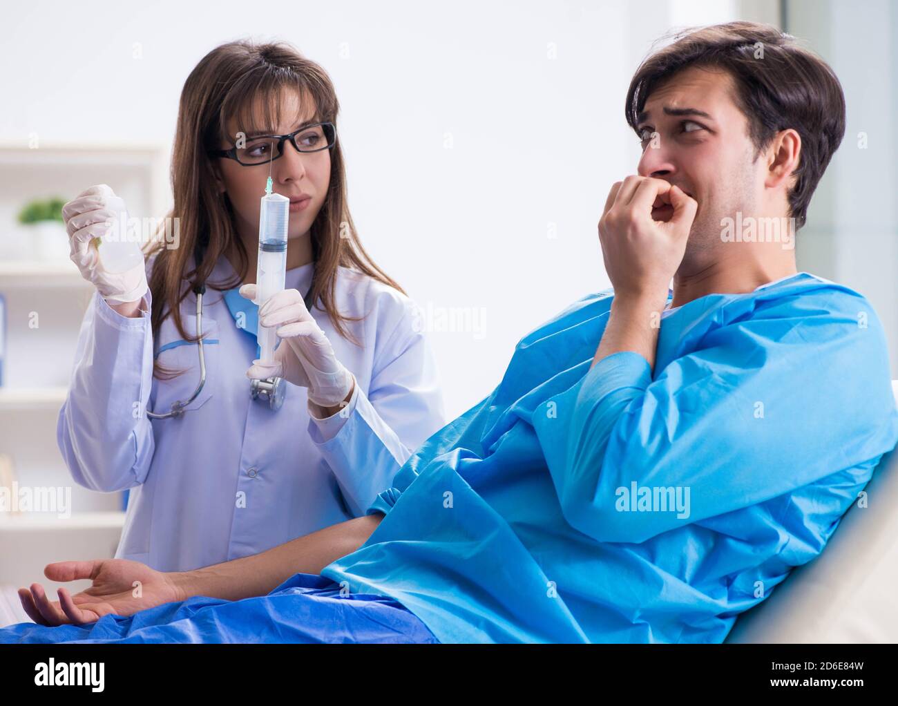 The scared patient man getting ready for flu shot Stock Photo - Alamy