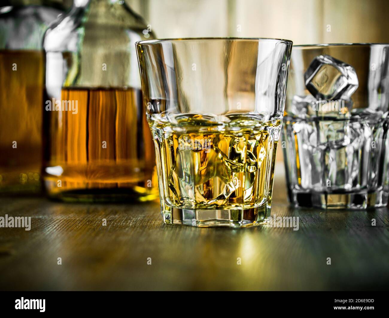 Whiskey on the rocks on a wooden background Stock Photo - Alamy