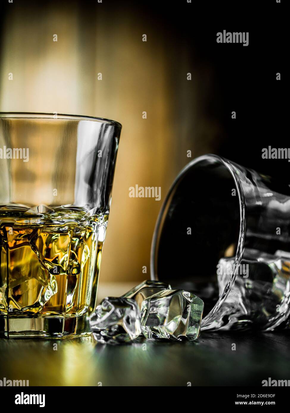 Whiskey on the rocks on a wooden background Stock Photo - Alamy