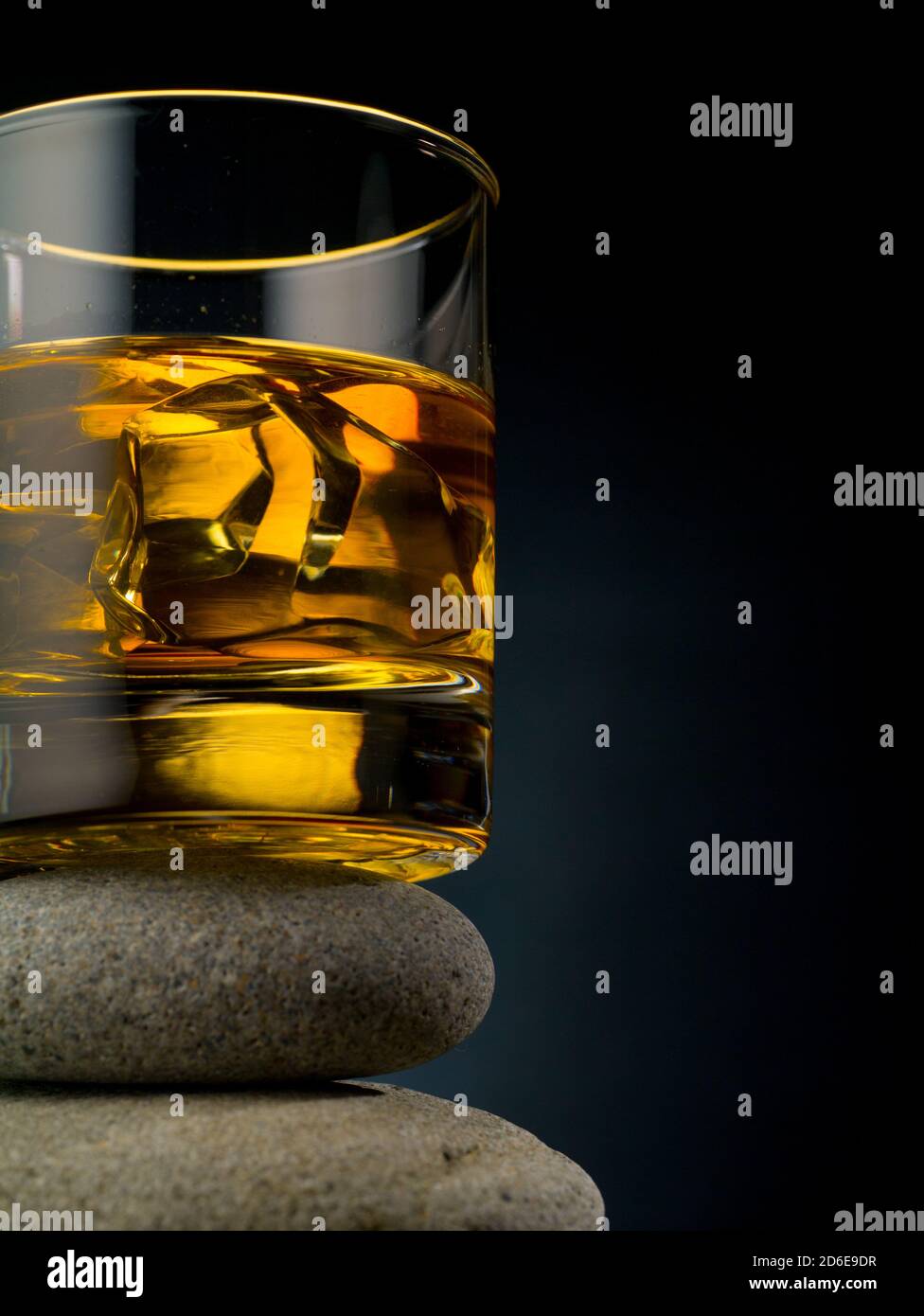 Glass of whiskey on the rocks standing on a pile of stones Stock Photo ...