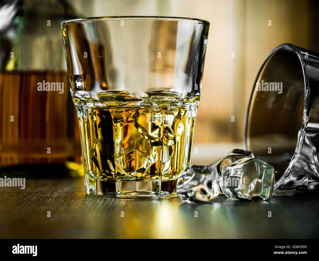 Whiskey on the rocks on a wooden background Stock Photo - Alamy