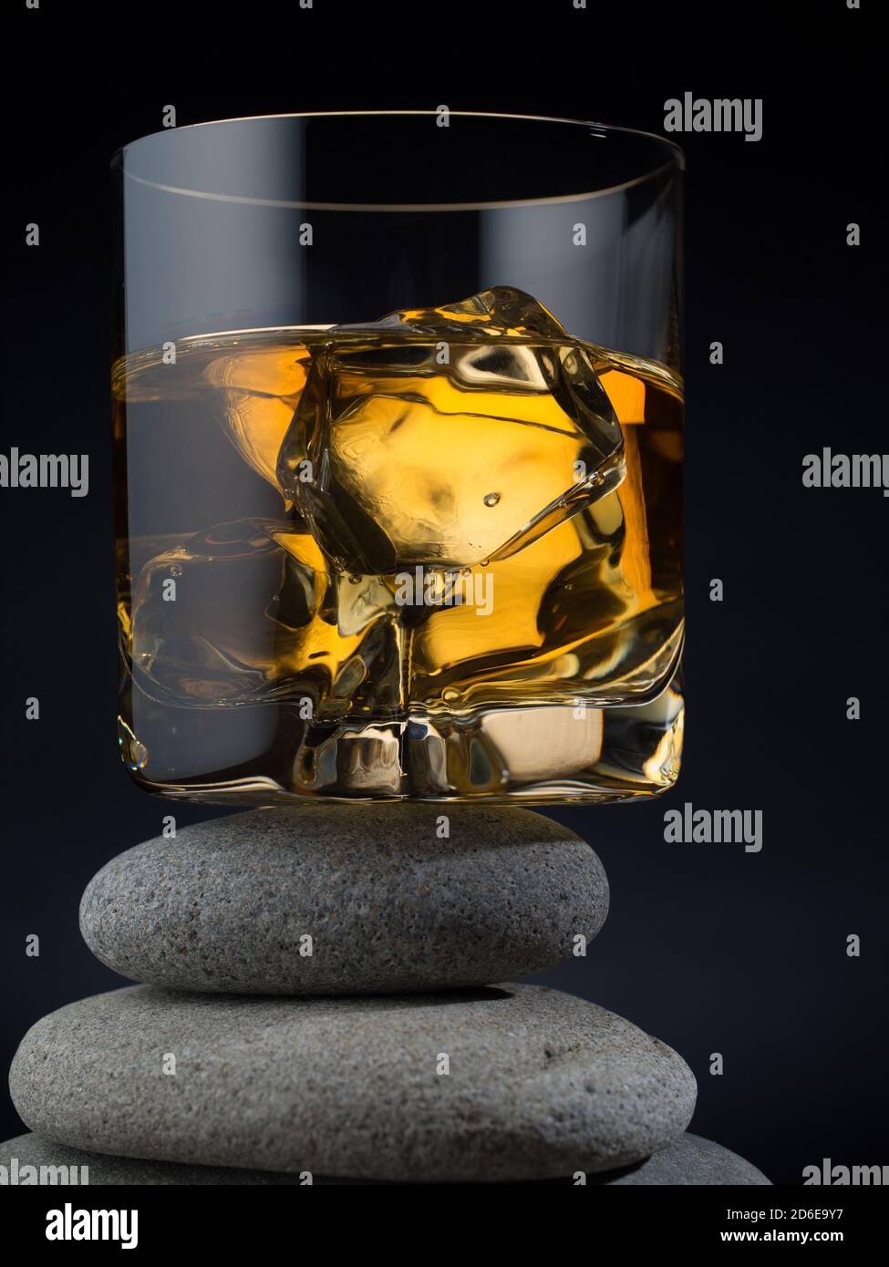 Glass of whiskey on the rocks standing on a pile of stones Stock Photo ...