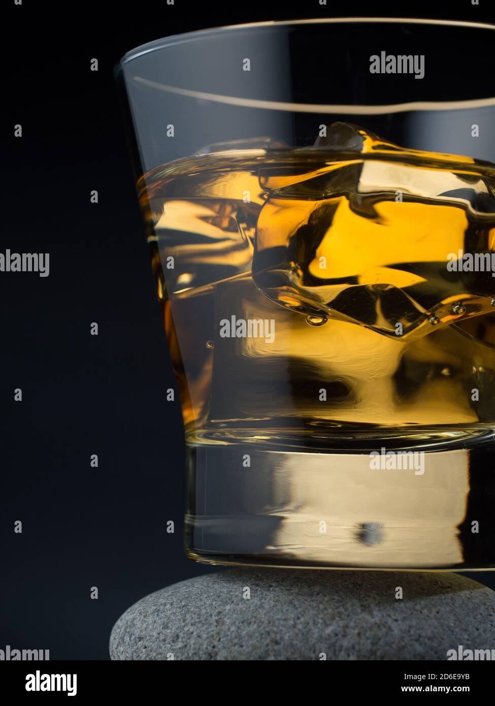 Glass of whiskey on the rocks standing on a pile of stones Stock Photo ...