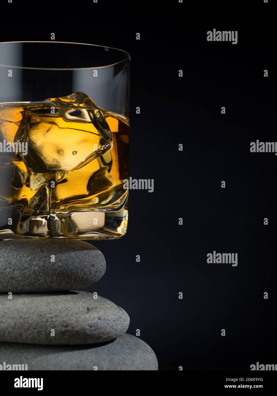 Glass of whiskey on the rocks standing on a pile of stones Stock Photo ...