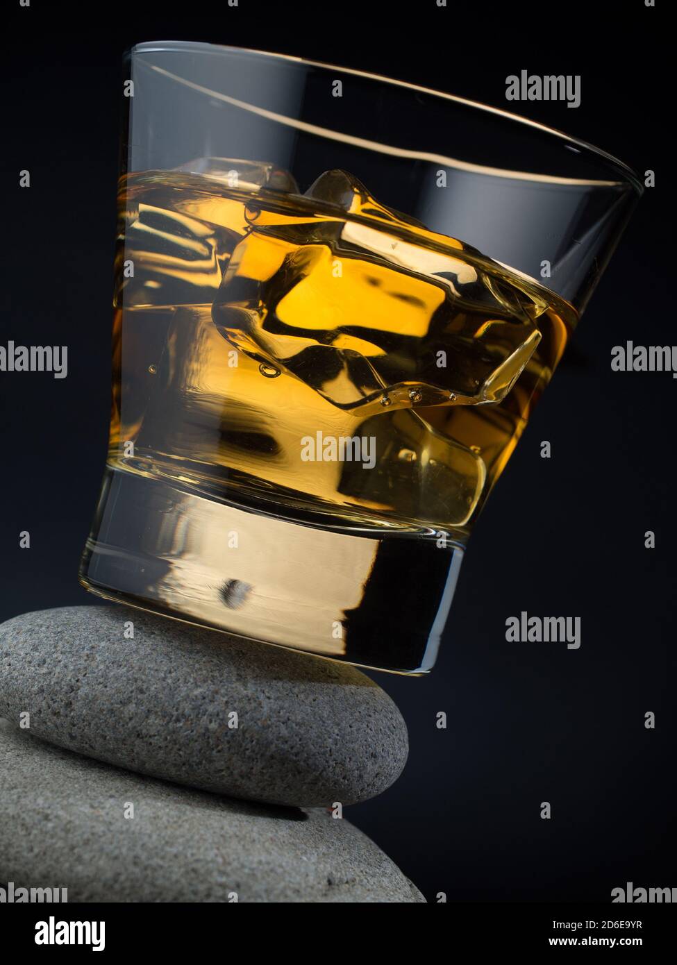Glass of whiskey on the rocks standing on a pile of stones Stock Photo ...