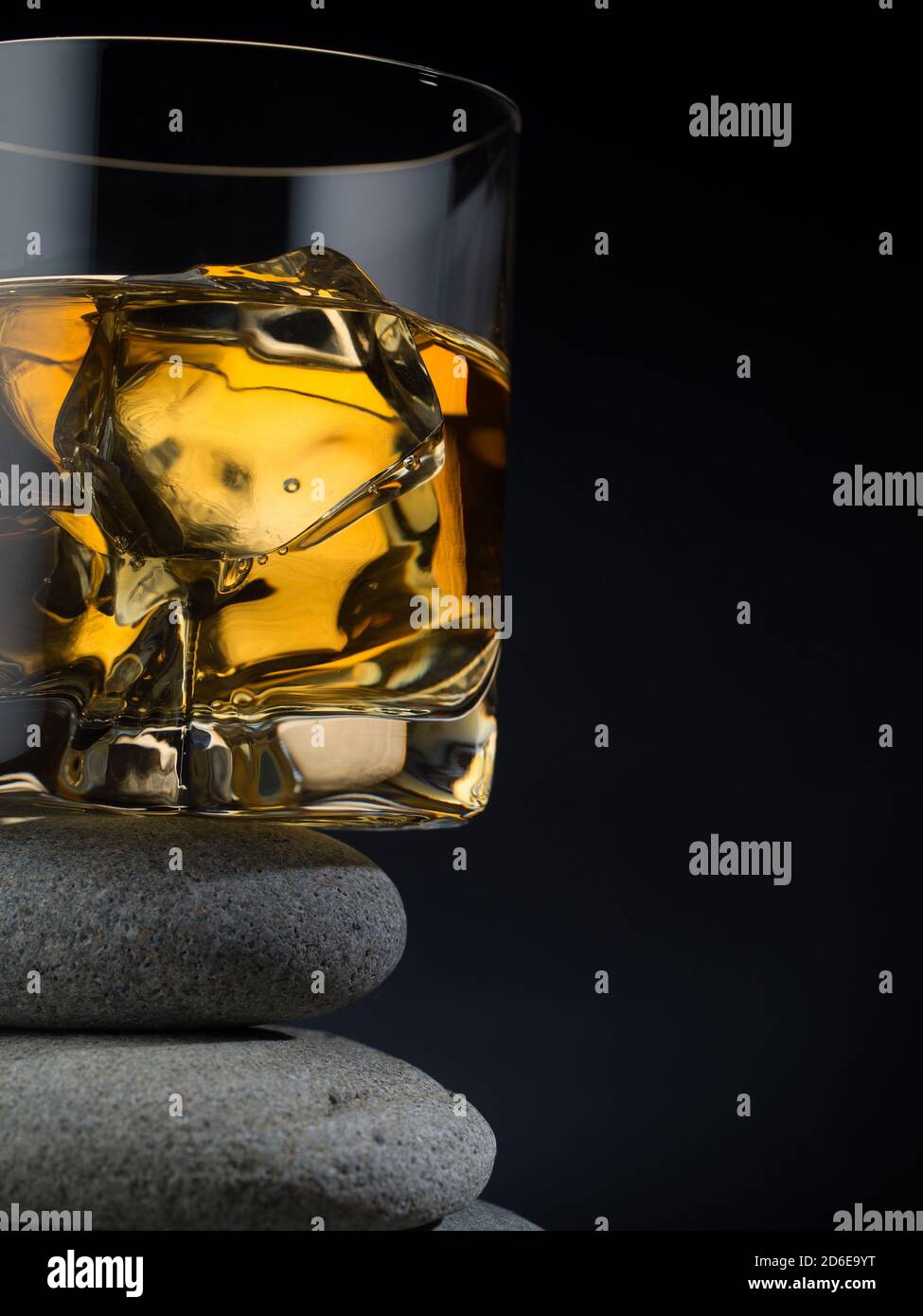 Glass of whiskey on the rocks standing on a pile of stones Stock Photo ...