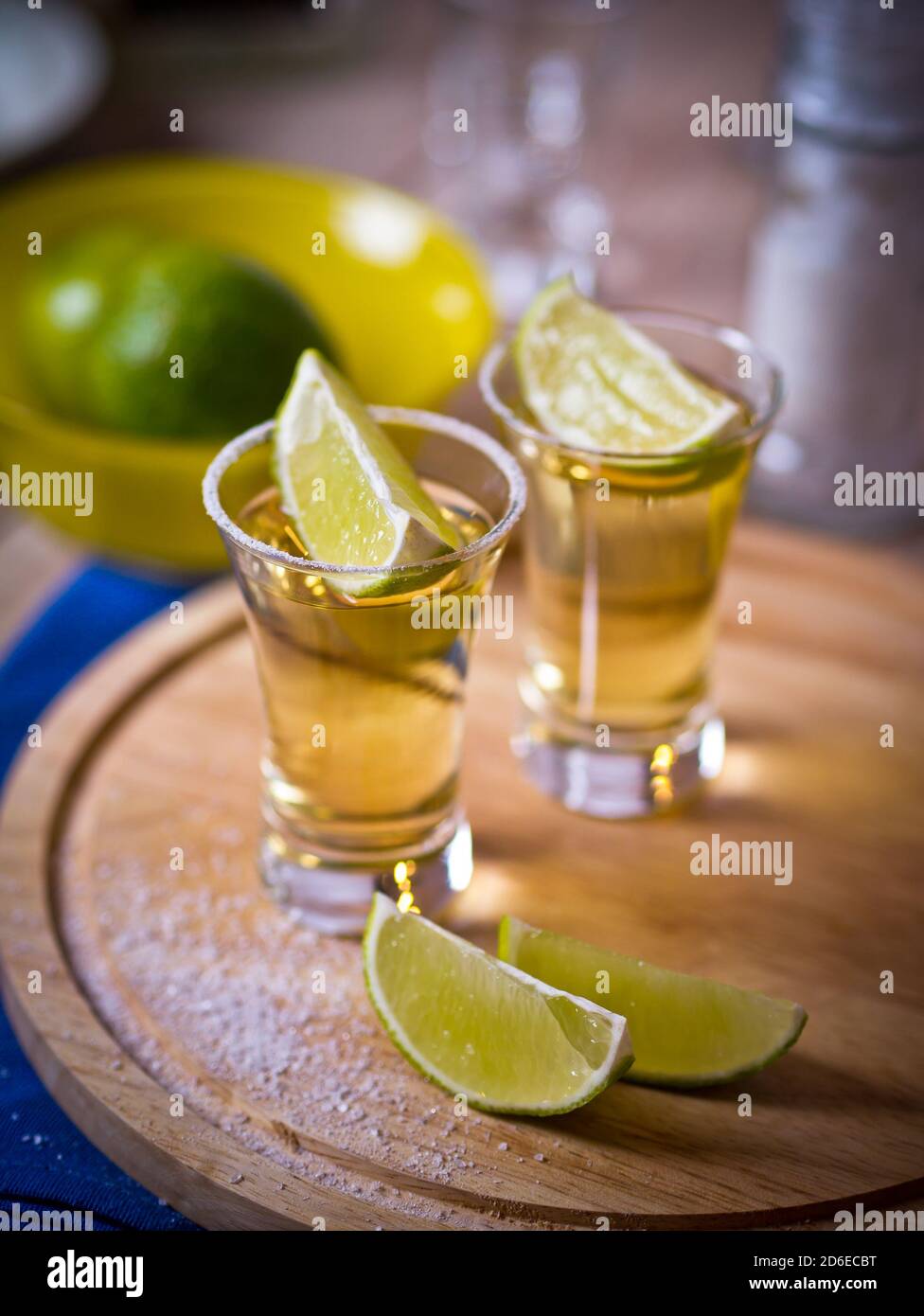 Tequila shots with wedges of lime and salt Stock Photo - Alamy