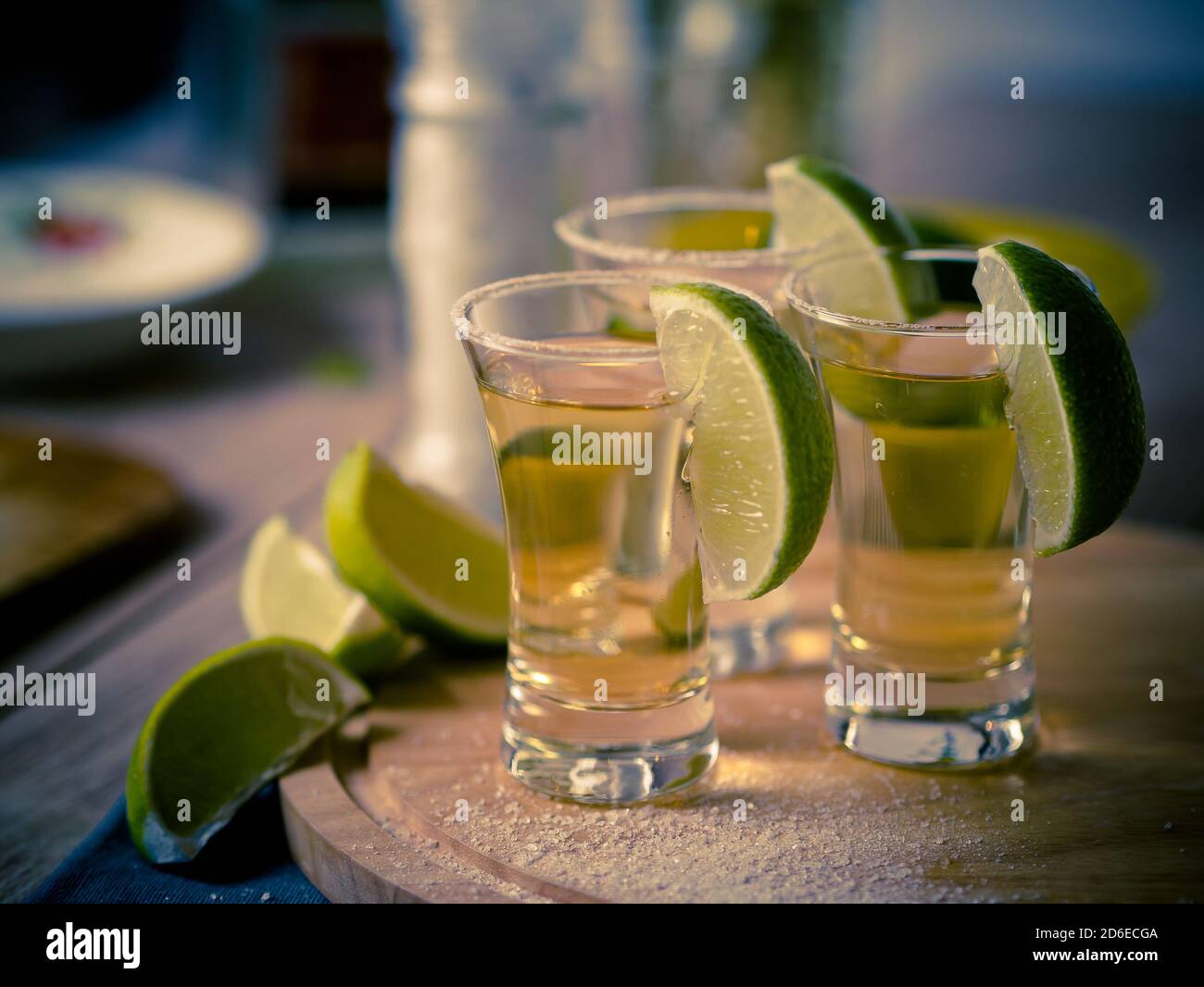 Tequila shots with wedges of lime and salt Stock Photo Alamy