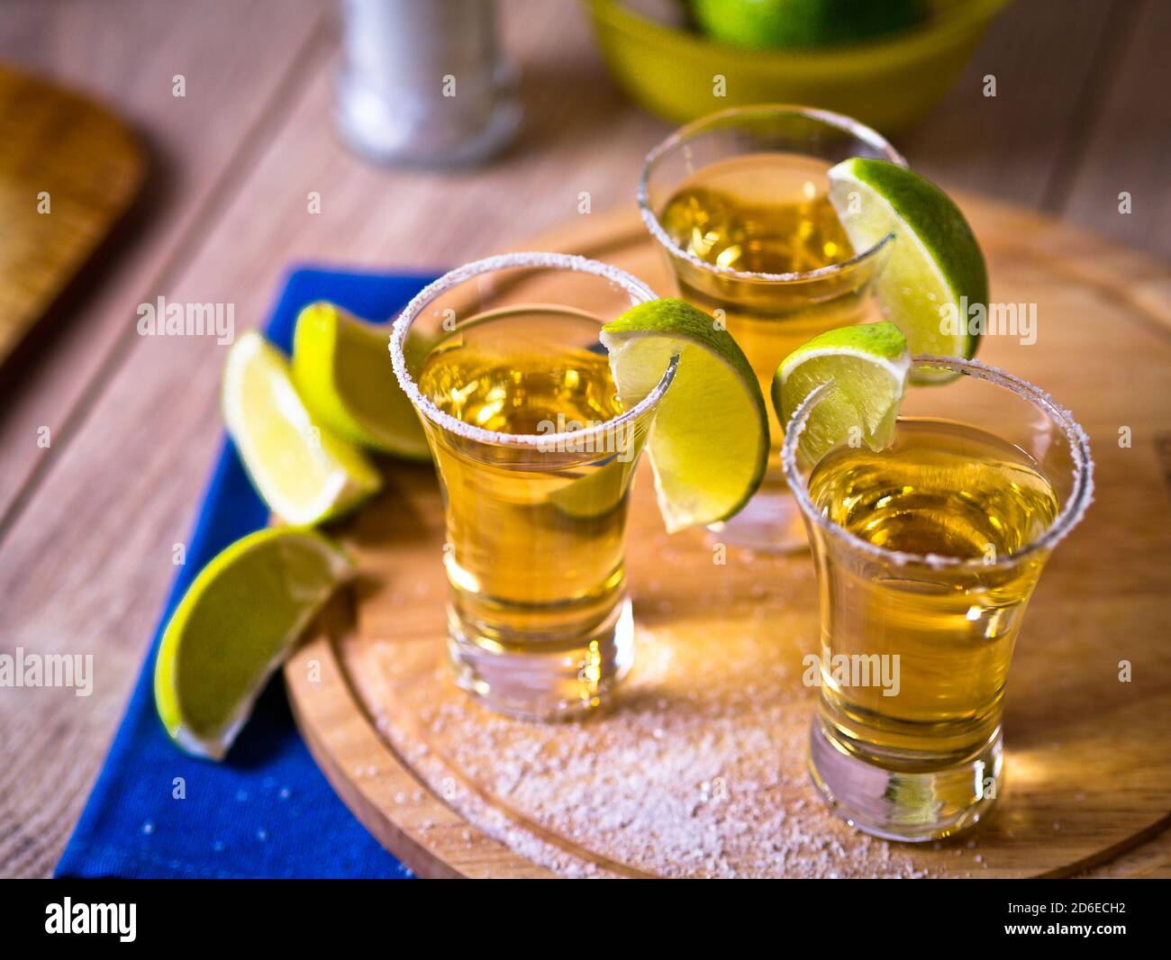 Tequila shots with wedges of lime and salt Stock Photo - Alamy
