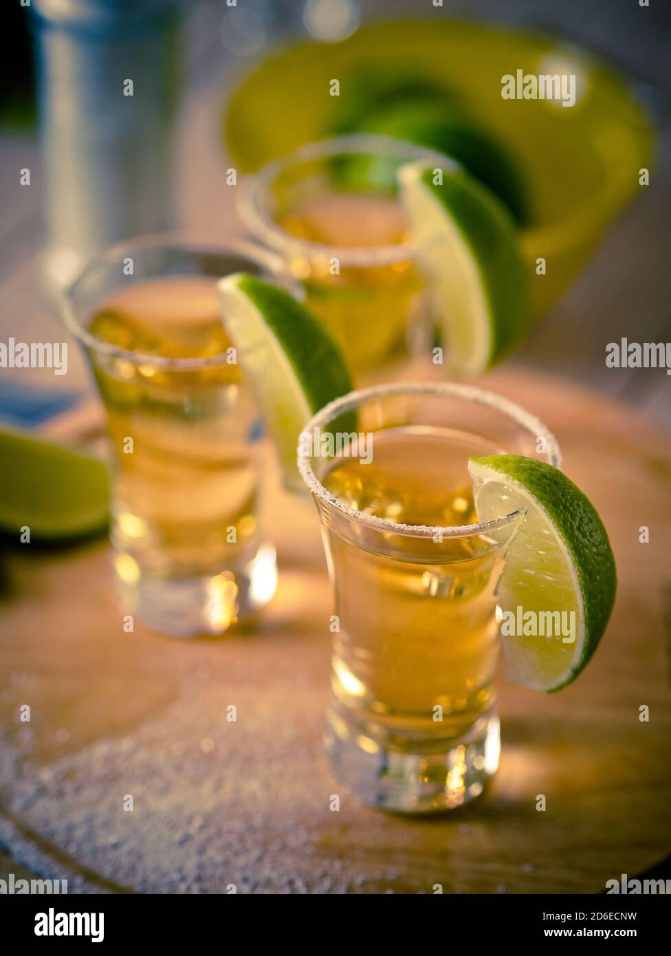 Tequila shots with wedges of lime and salt Stock Photo Alamy