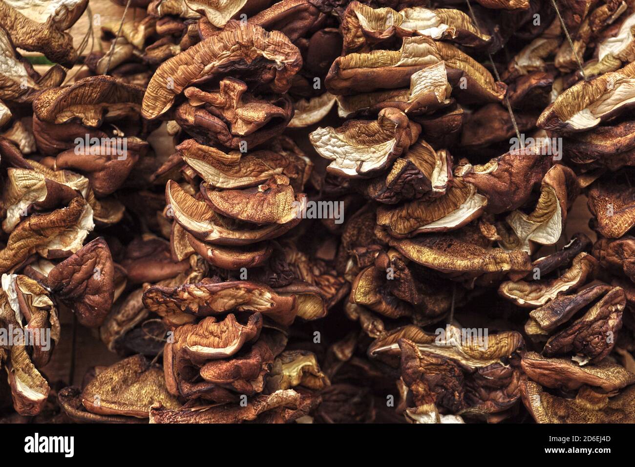 Strings of dried mushrooms. In many countries, an essential addition to