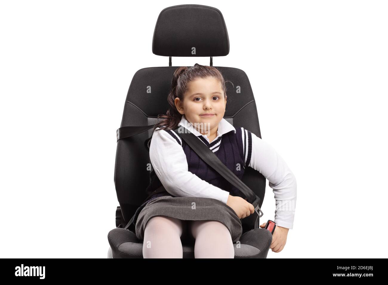 Child sitting in a car seat and putting a seatbelt on isolated on white