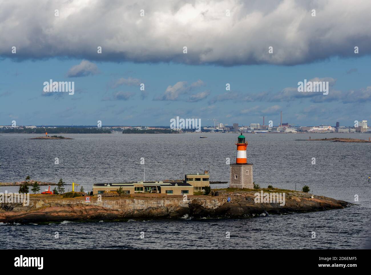 Small rocky island Harmaja with little lighthouse and metal tower in Gulf of Finland Stock Photo