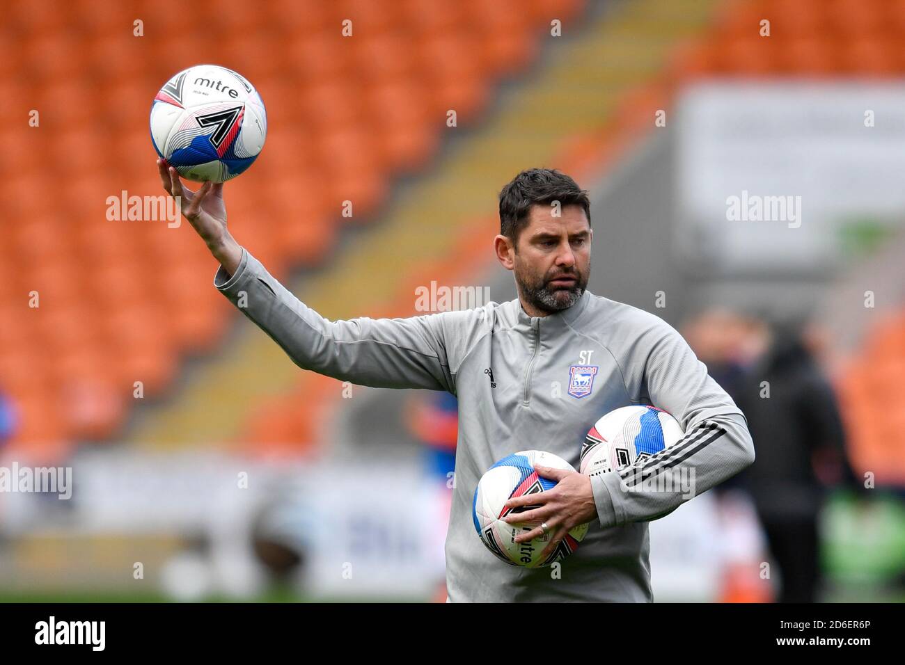 Stuart Taylor assistant manager of Ipswich leads the warm up Stock Photo