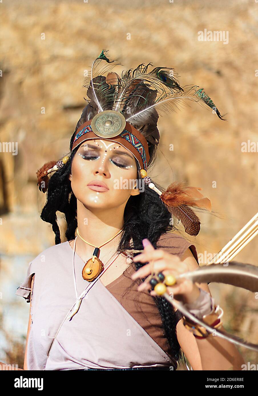 Closeup image of a woman dressed as a Native American with her eyes closed Stock Photo