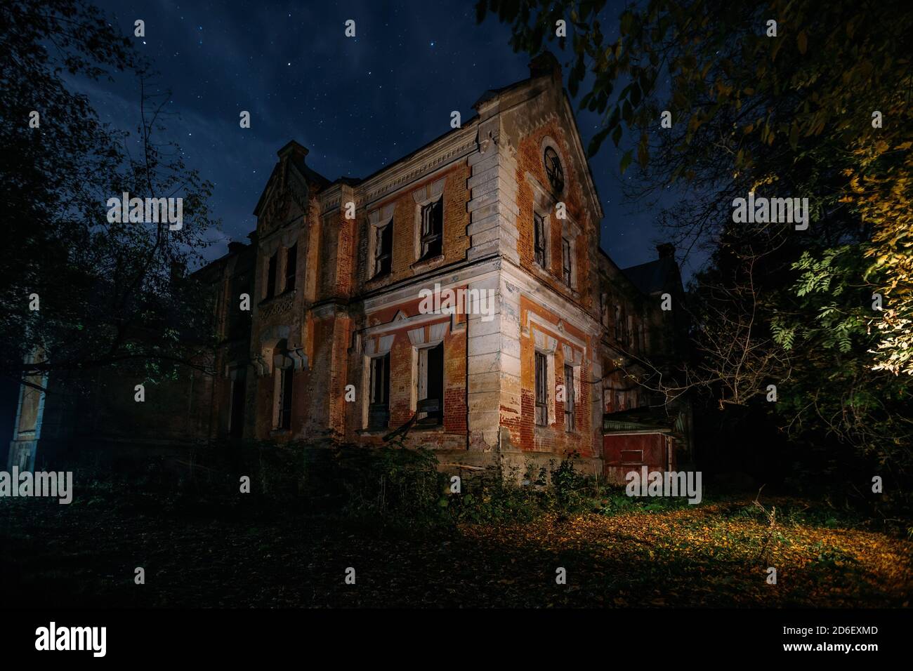 Dark and creepy old abandoned haunted mansion at night. Former Karl von