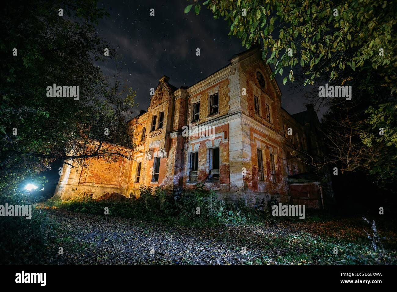 Dark and creepy old abandoned haunted mansion at night. Former Karl von