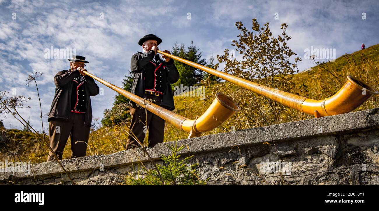 Alphorn musicians in the Swiss Alps - typical view - COUNTY OF BERN. SWITZERLAND - OCTOBER 9, 2020 Stock Photo