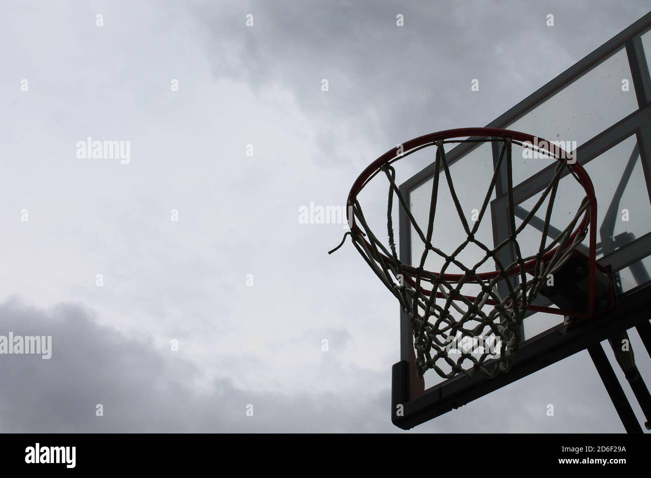 Basketball hoop on a overcast day Stock Photo - Alamy