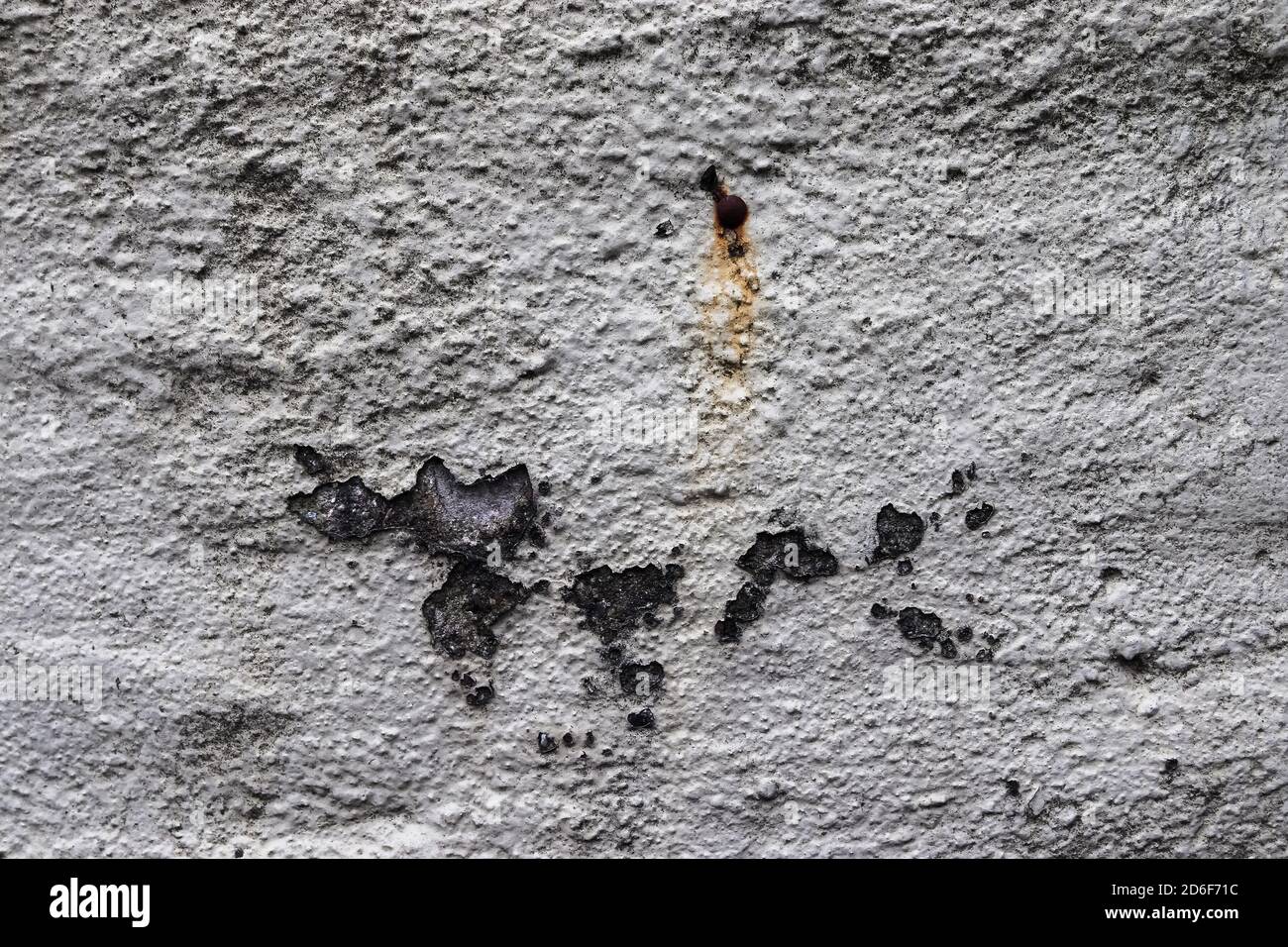 Detailed close up view on aged concrete walls with cracks and lots of structured details Stock Photo