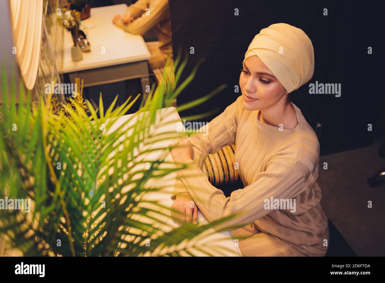 Portrait of a beautiful, elegant and attractive young Malay Asian Muslim  woman in a dress and an hijab head scarf Stock Photo - Alamy