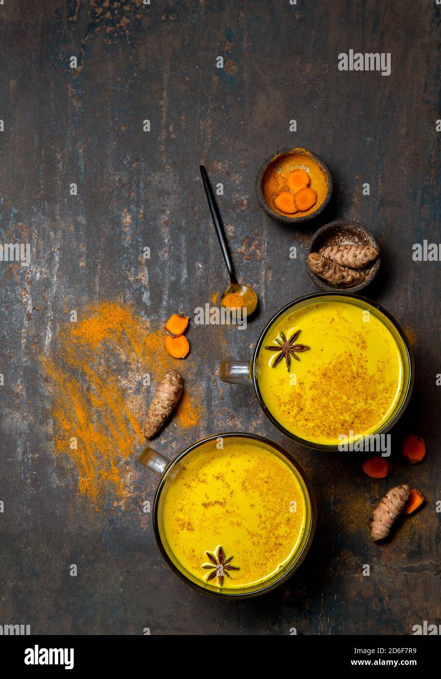 Hot drink golden milk turmeric latte with curcuma powder and spices. Top view Stock Photo