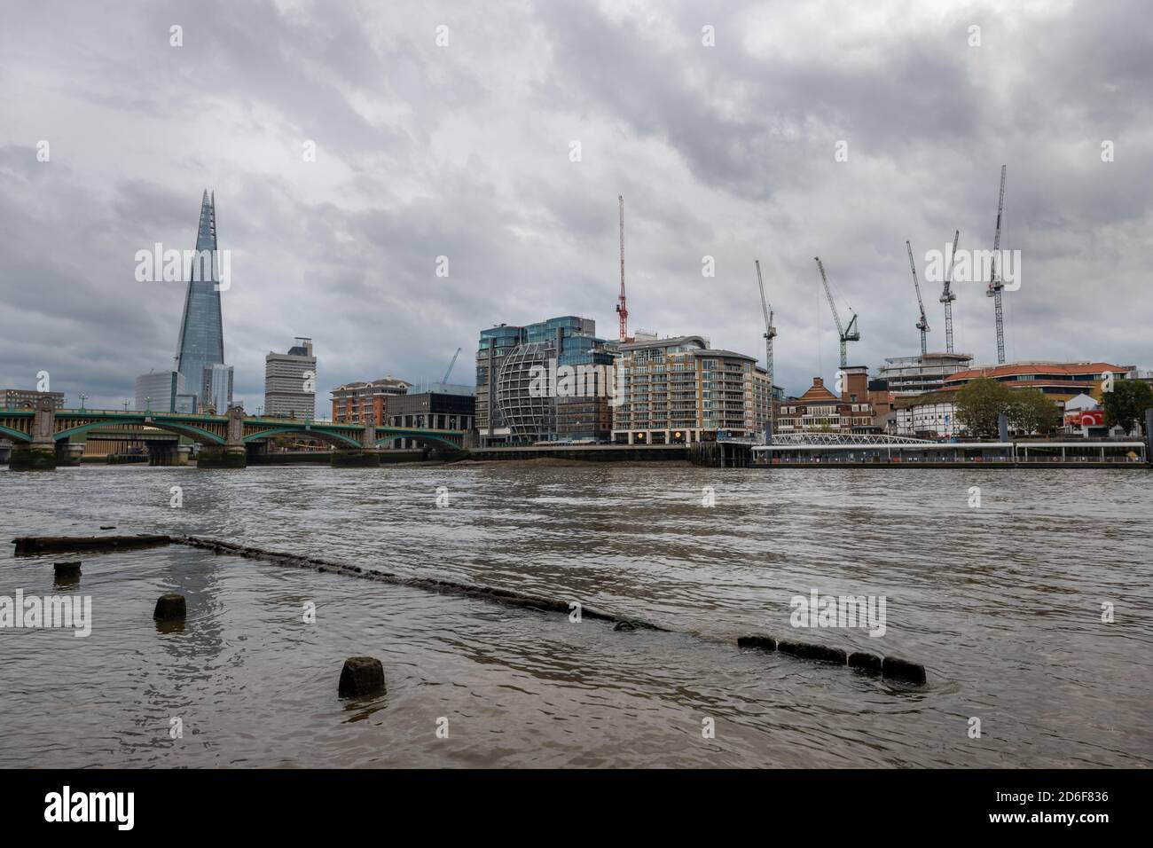 A London skyline view from the shore of the Thames river. Stock Photo