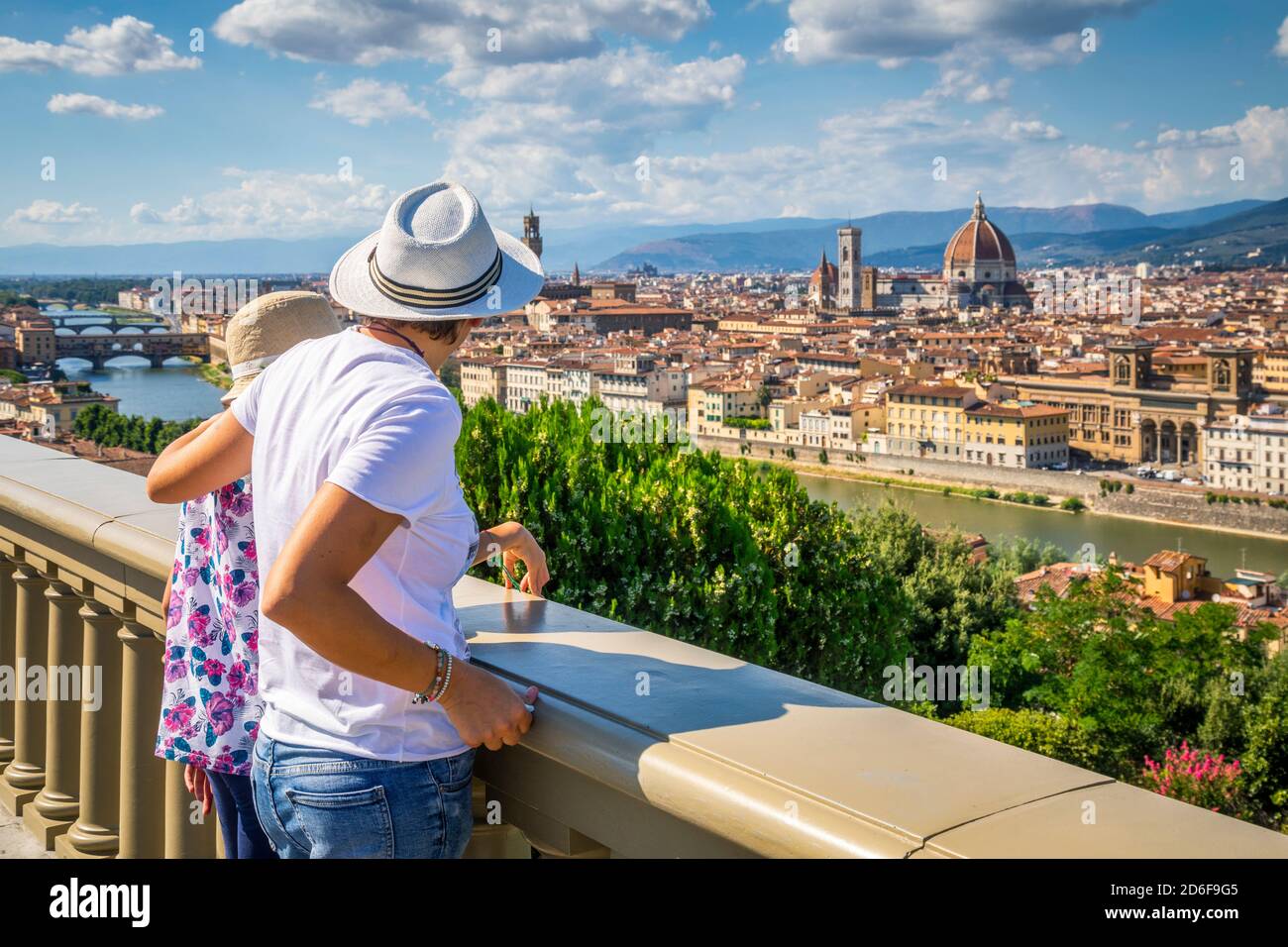 two tourists (mother and daughter) are admiring the historic center of Florence, elevated view from the panoramic point of piazzale michelangelo, Florence, Tuscany, Italy, Europe Stock Photo