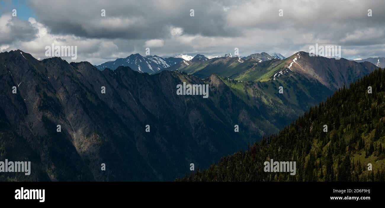 Cloudy sky with mountain forest hi-res stock photography and images - Alamy