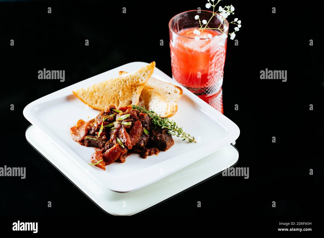 beef goulash on a black background Stock Photo