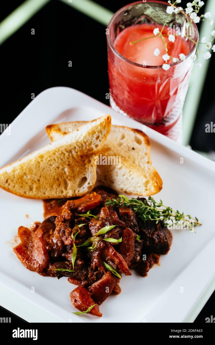 beef goulash on a black background Stock Photo