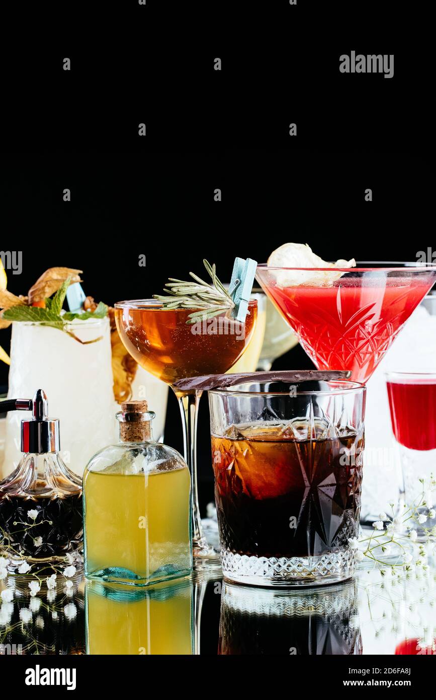 alcoholic cocktails on a mirror background Stock Photo - Alamy