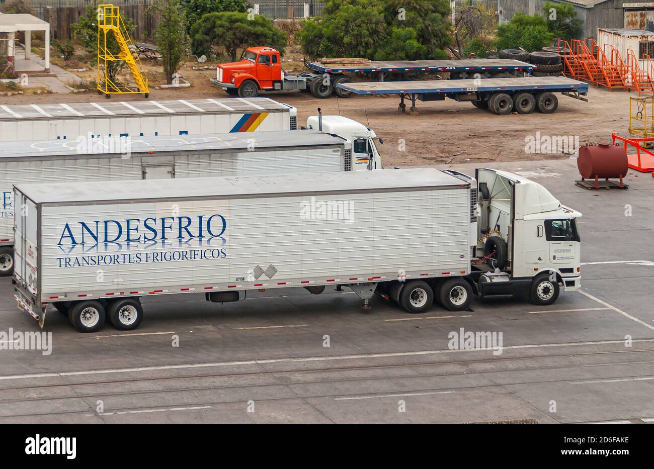 Coquimbo, Chile - December 7, 2008: White refrigerator truck of Andesfrio company parked in port. Other trucks and trailers present. Stock Photo