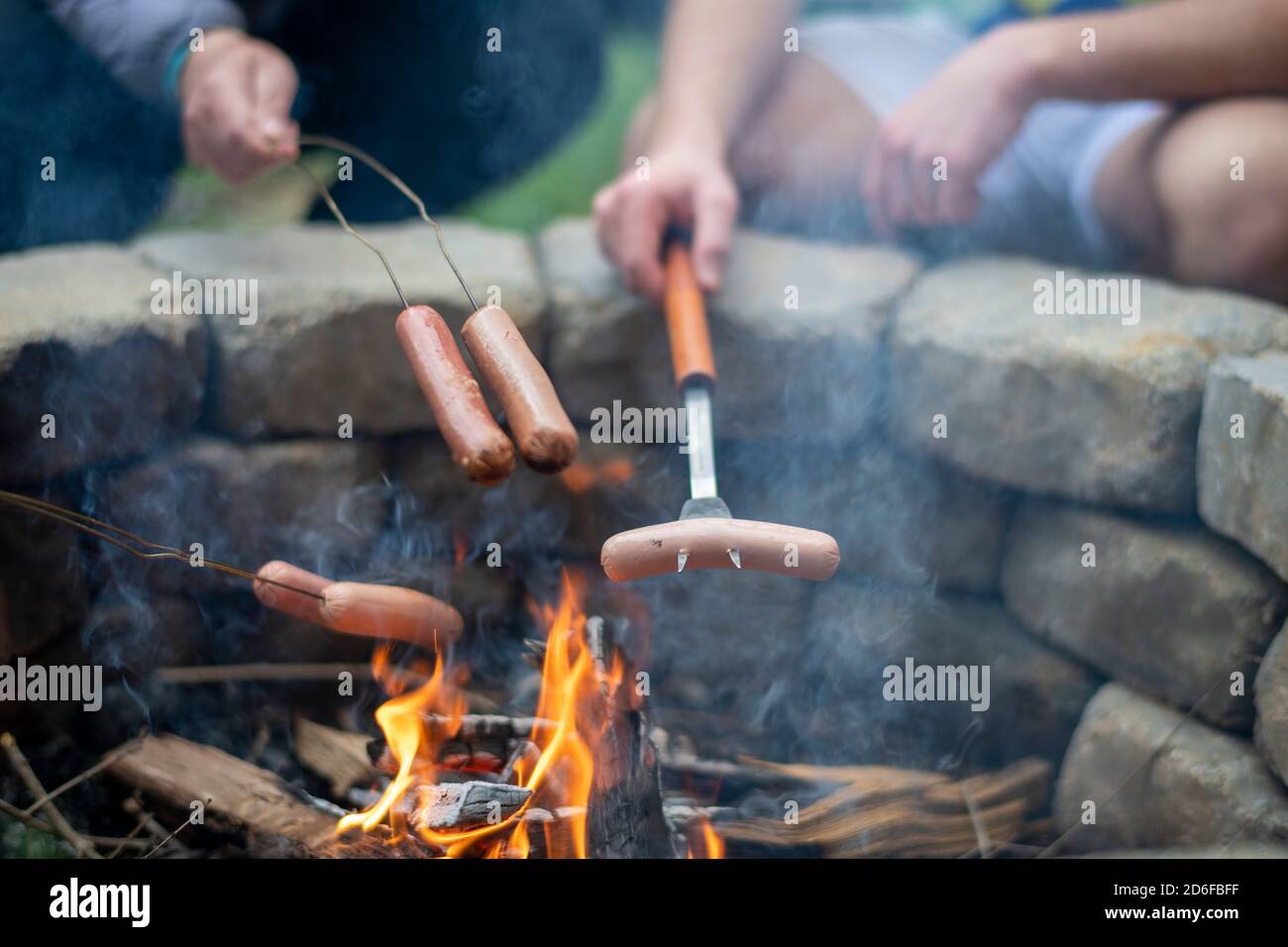 Roasting hot dogs at campfire hires stock photography and images Alamy