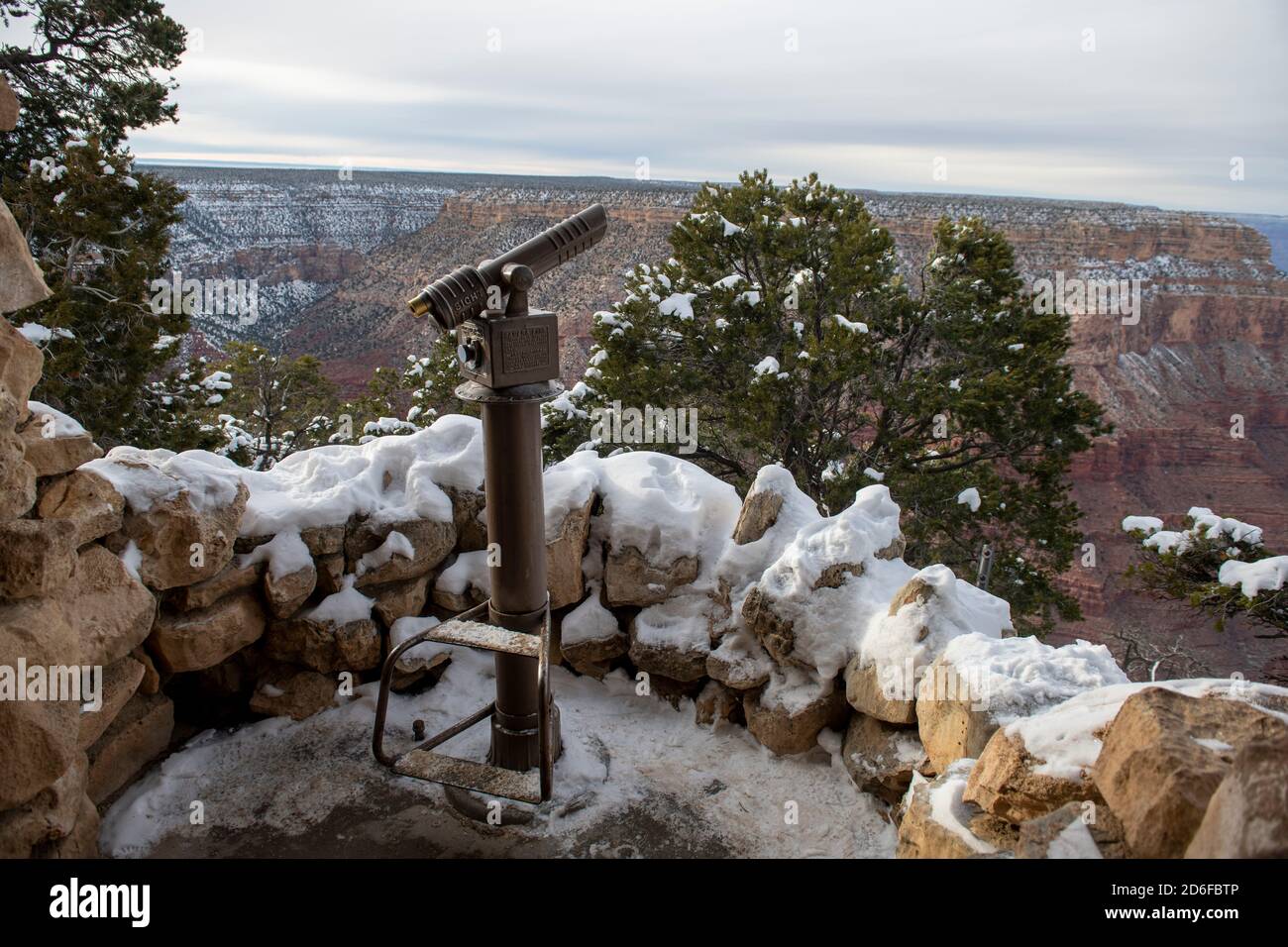 Snowy coin-operated telescope at South Rim Grand Canyon viewpoint Stock Photo
