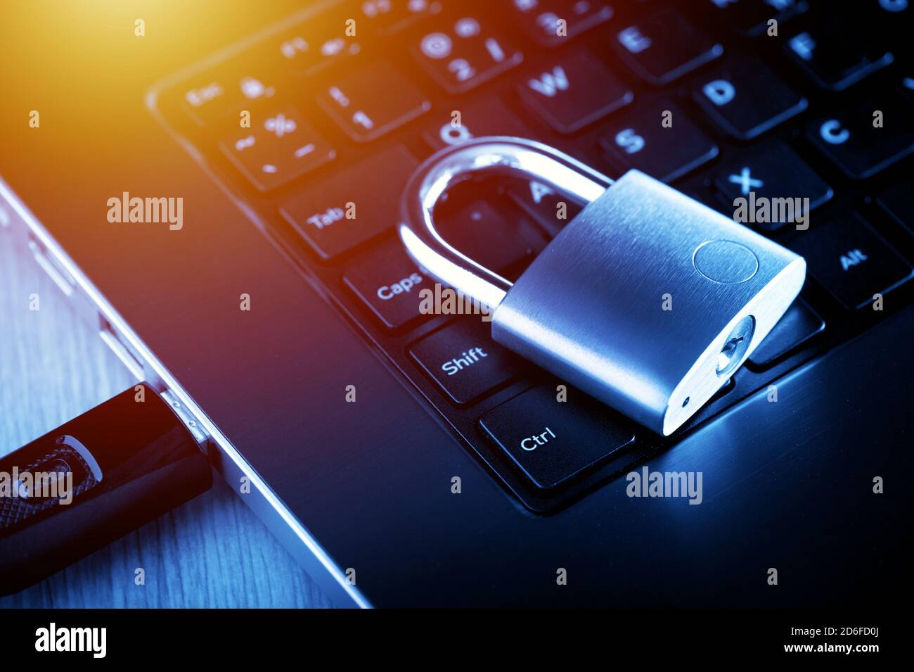 locked padlock on the laptop's keyboard, computer and data security concept. Stock Photo