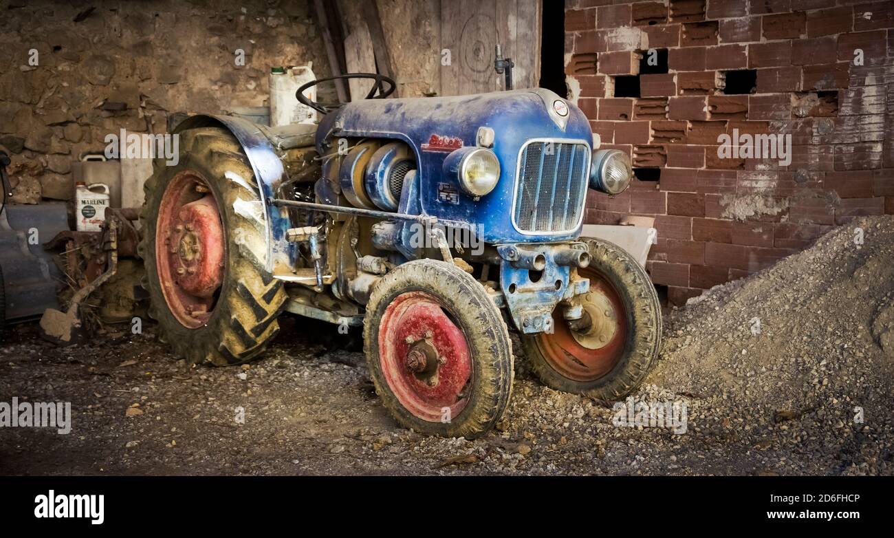 Old Eicher tractor for viticulture in Assignan Stock Photo