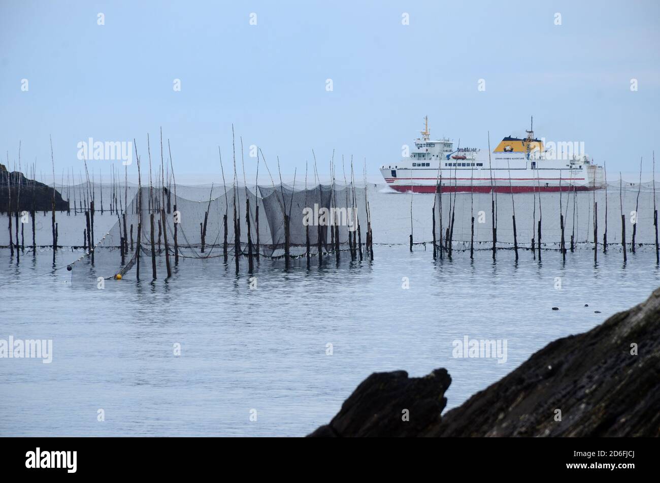 Fishing weir on Grand Manan Island, with the ferry behind Stock Photo
