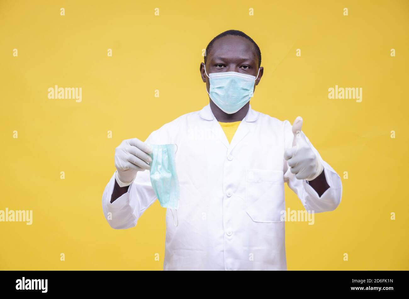 Doctor mask showing thumbs hi-res stock photography and images - Alamy