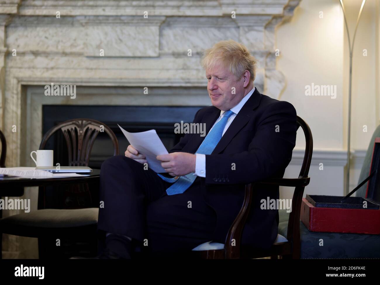 (201017) -- LONDON, Oct. 17, 2020 (Xinhua) -- British Prime Minister Boris Johnson prepares his Brexit statement in his office at 10 Downing Street, before filming a clip to the media on his reaction after the EU Summit, in London, Britain, on Oct. 16, 2020. Boris Johnson said Friday that as the European Union (EU) Summit in Brussels refused to offer London a Canada-style deal, Britain will prepare to embrace a no-trade deal scenario. Johnson made the response following the EU Summit discussions on Brexit Thursday. EU's chief Brexit negotiator Michel Barnier said he will continue intensive tal Stock Photo
