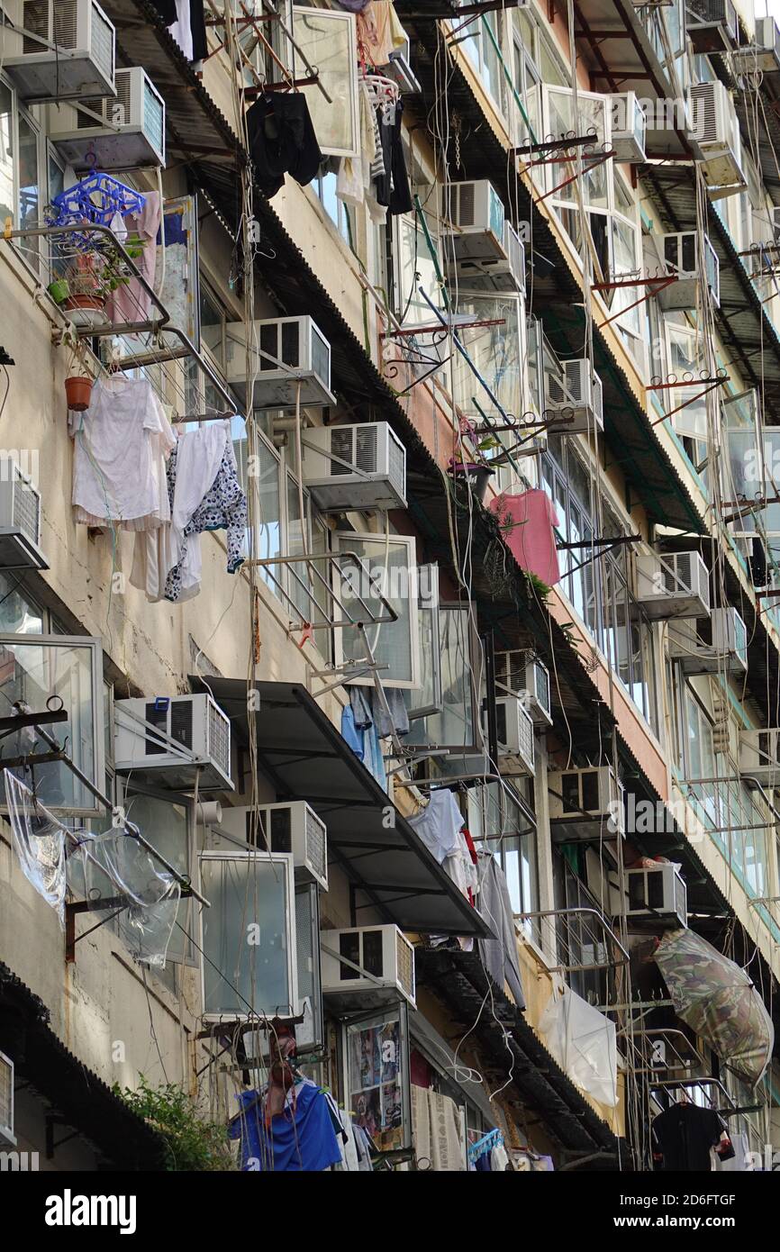 Old apartment building in Hong Kong. clothes hanging to dry Stock Photo