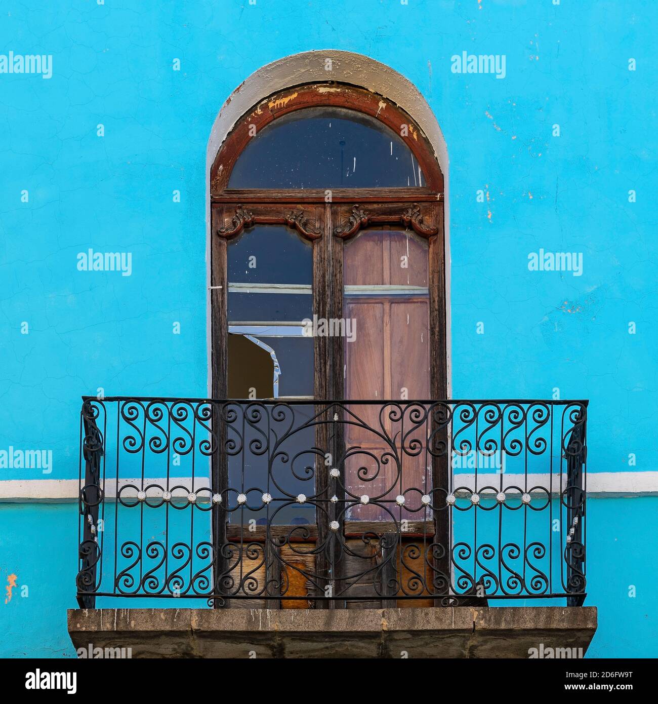 Weathered colonial style balcony with blue facade, Potosi, Bolivia. Stock Photo