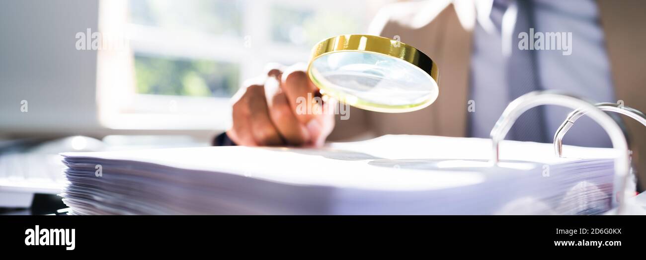 IRS Tax Audit. African Auditor Doing Debt Fraud Inspection Stock Photo ...