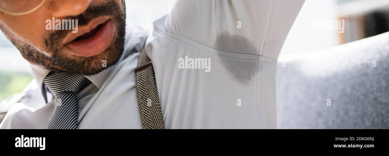 Armpit Sweat Stain From Deodorant Or Hyperhidrosis. Men Sweating Stock Photo