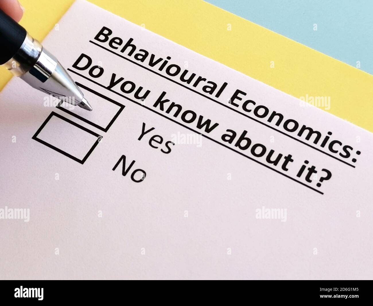 One person is answering quetion about behavioural economics. Stock Photo