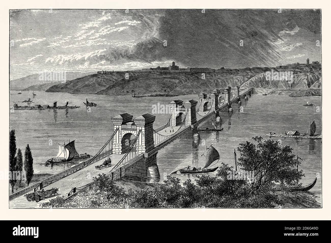 An old engraving showing The Nicholas (Nikolaevsky) Chain Bridge over the Dnieper in Kyiv (Kiev), Ukraine. It is from a Victorian mechanical engineering book of the 1880s. The bridge was designed by British/Irish engineer Charles Blacker Vignoles. Construction started in 1848 and was completed in 1853. The 776-metre-long (2,546 ft) bridge was the largest at that time in Europe. In 1920, during the Polish-Soviet War, the bridge was blown up by retreating Polish troops. It was rebuilt with major changes in 1925 and named the Yevgenia Bosch Bridge. Stock Photo