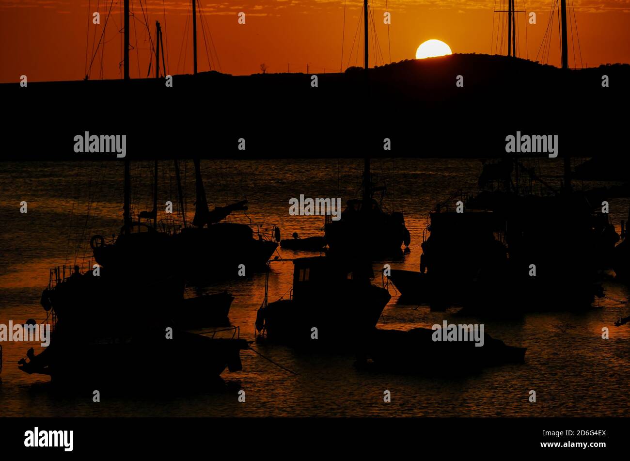 Sunset in harbor with Boats Silhouette Stock Photo - Alamy
